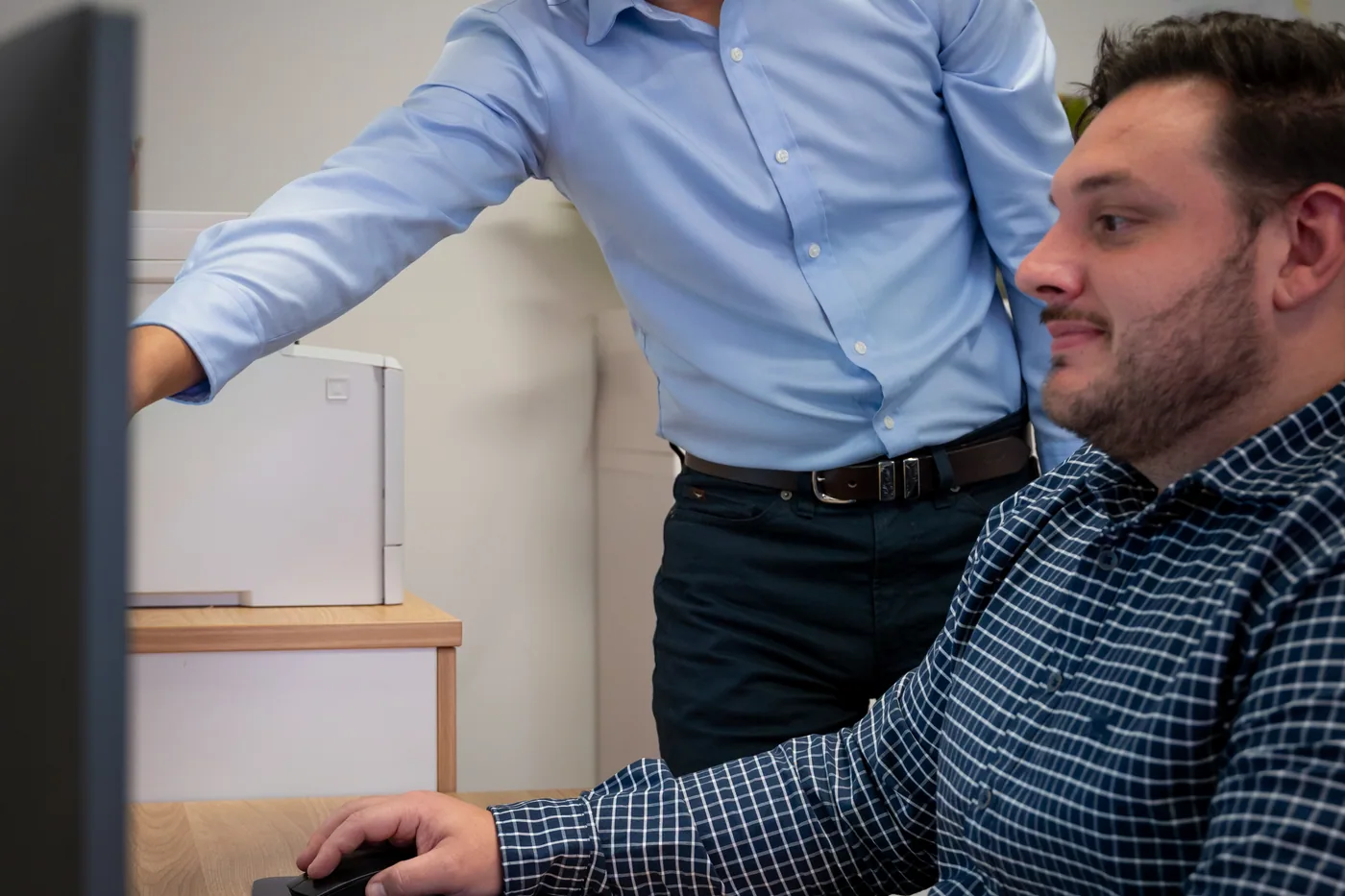 Two Quantum Finance brokers working through a first home buyer's file together