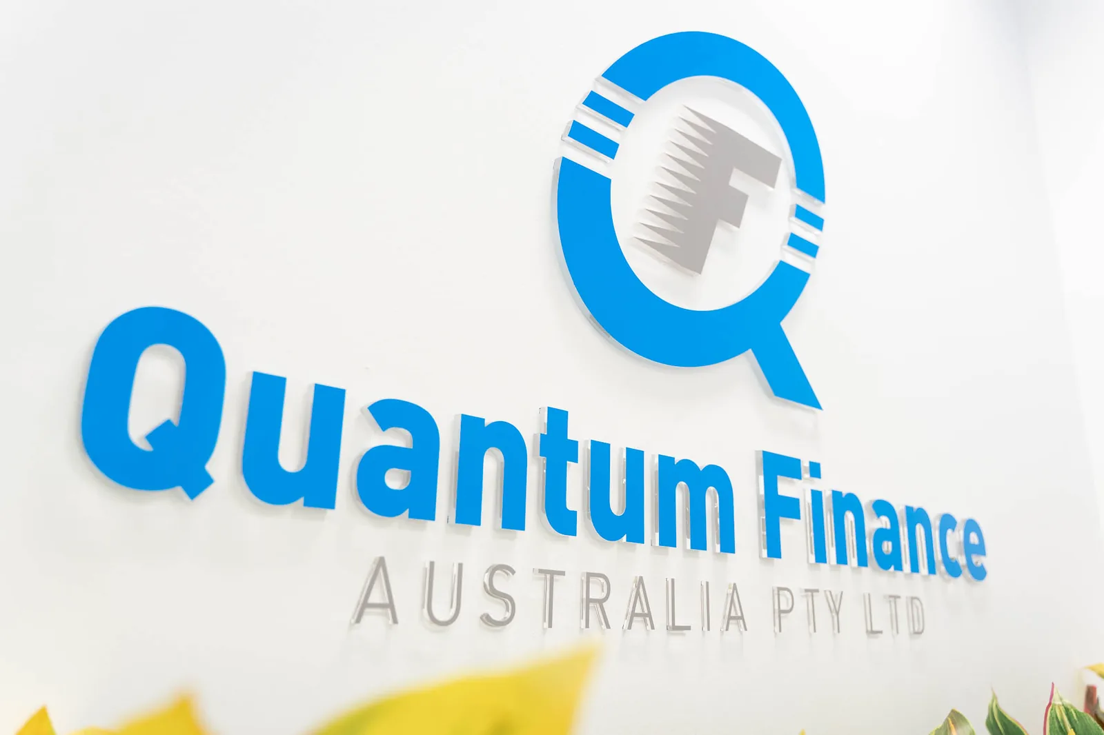 The Quantum Finance wordmark on the wall of the West Leederville office