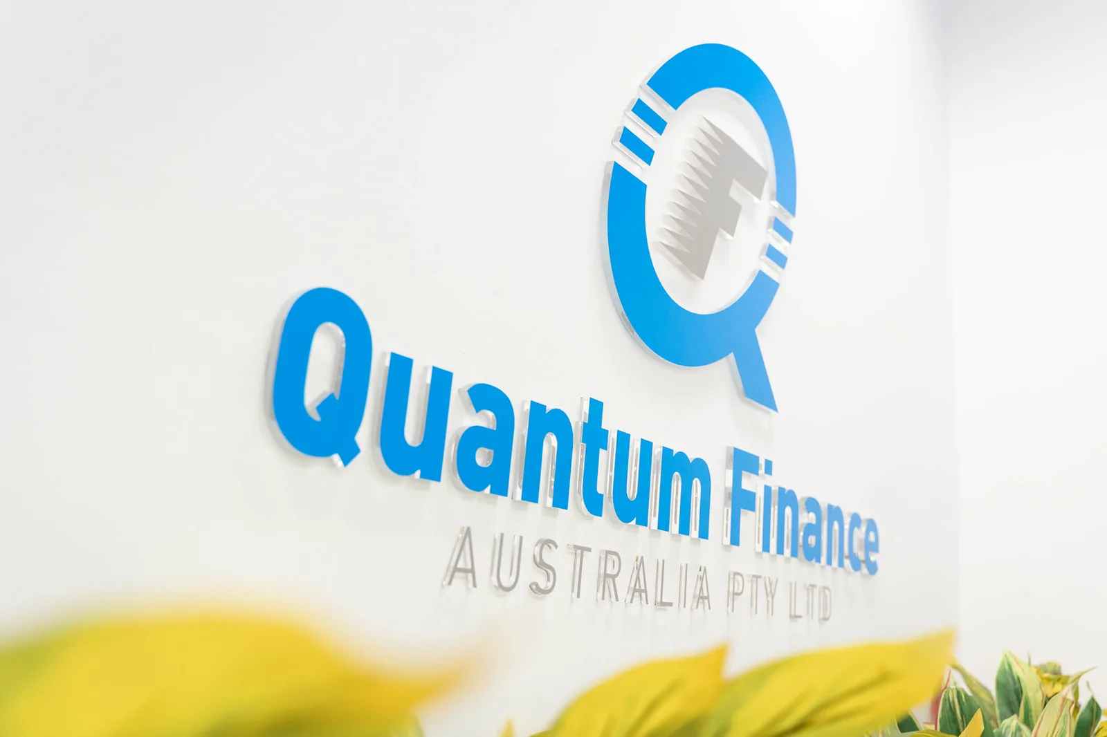 The Quantum Finance wordmark on the meeting room wall at the West Leederville office