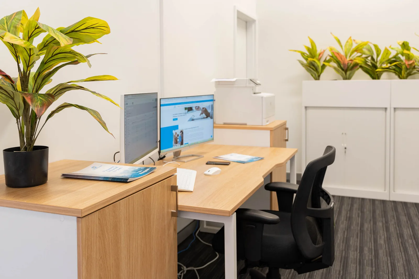 A row of workstations at the Quantum Finance office in West Leederville
