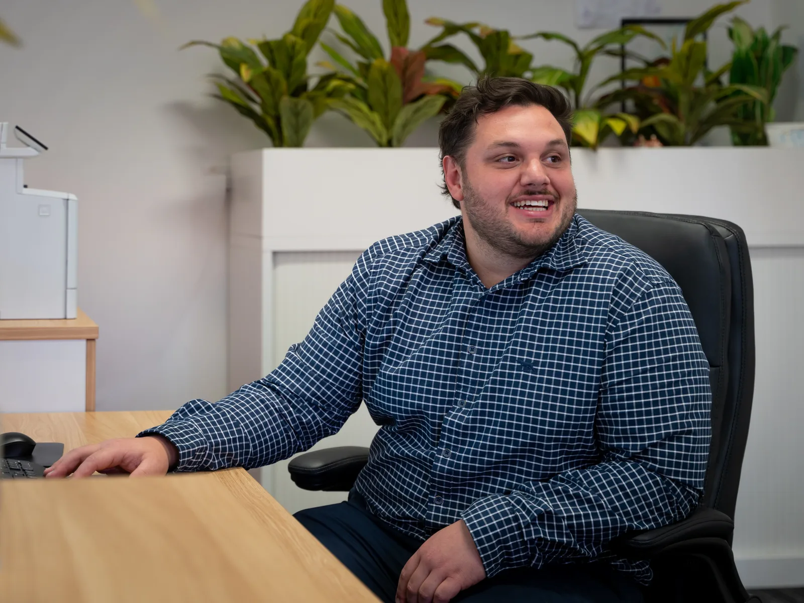The open-plan Quantum Finance Australia office in West Leederville, with a broker at his desk