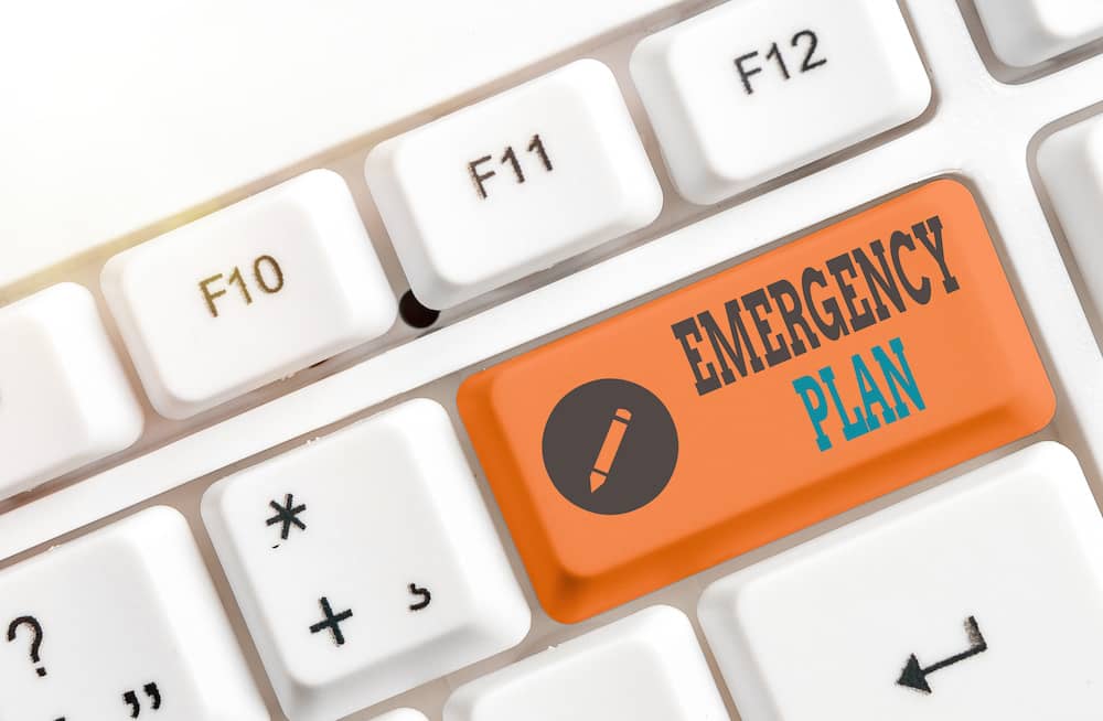 Emergency plan button highlighted in orange on a key board.