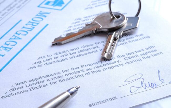 Signed mortgage contract and keys.