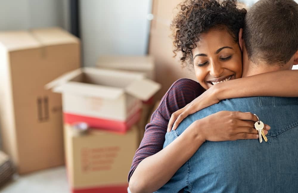 A couple moving into their new home.