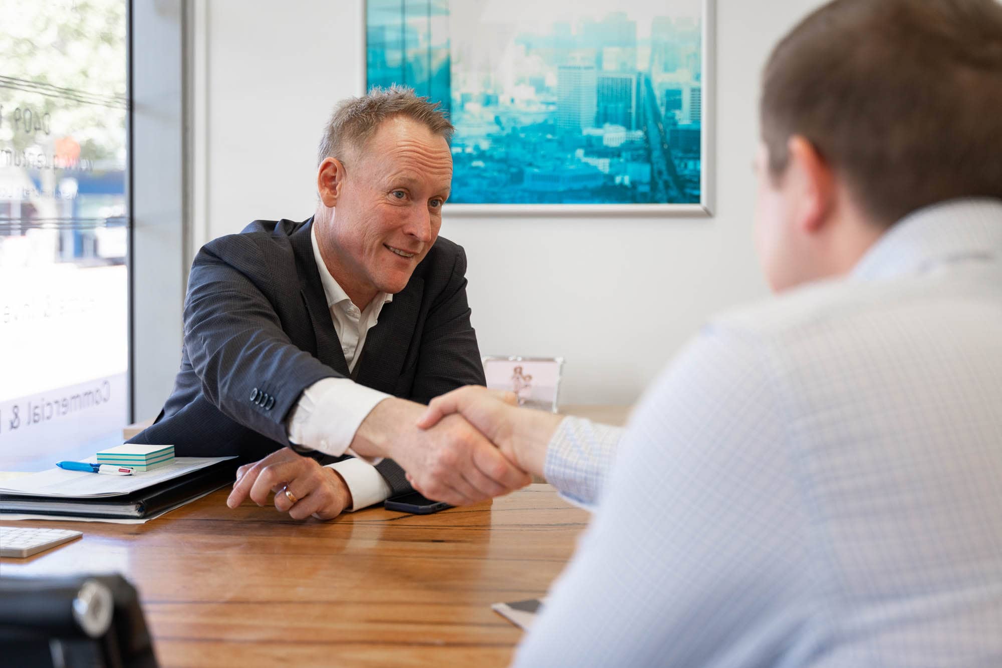 Quantum Finance Mortgage Broker shaking a client's hand